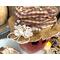 This is a close-up of Mac's custom hat. It is made with fall calico fabric and is decorated with a handmade lace rosette and dried berries.